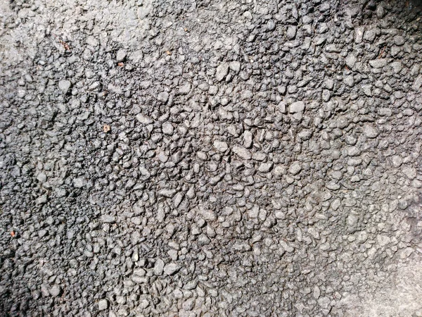 道路灰色のラフ構造表面テクスチャアスファルト材料の背景を閉じます — ストック写真