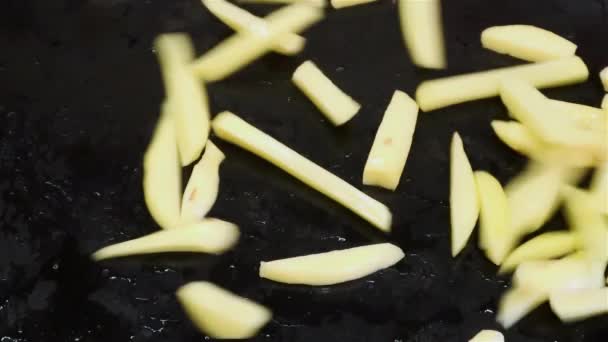 Drop Long Cut Spiced Raw Fries Potatoes Slices Black Pan — Stock Video