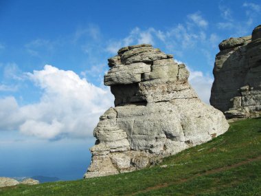 Rocks in the Valley Of Ghosts on the Southern Demerdzhi Mountain, Crimean mountains. Located near Alushta city with epic clouds, nature hiking clipart