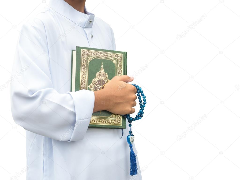 Asian muslim child  reads the holy Quran