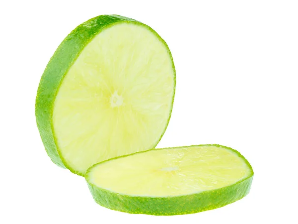 Skivad grön citroner, är citron en syrlig saftiga frukter — Stockfoto