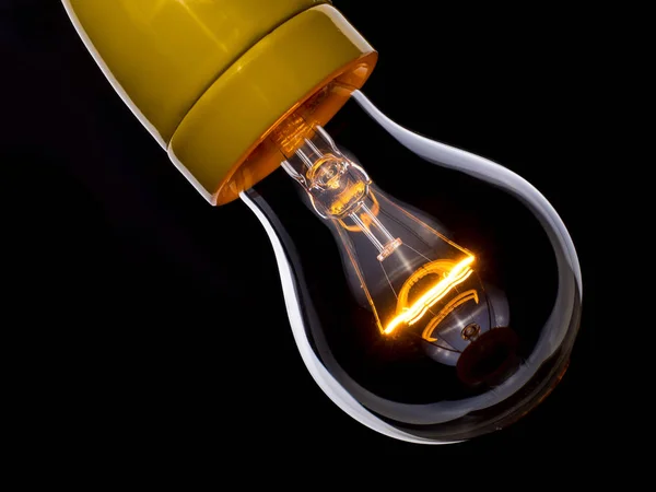 close up shot on light bulb on the dark for creativity