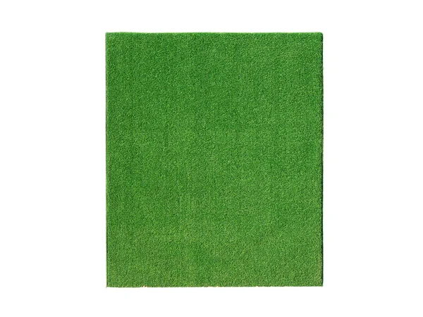 Umělé zelené trávě na svislé rovině izolované na bílém — Stock fotografie