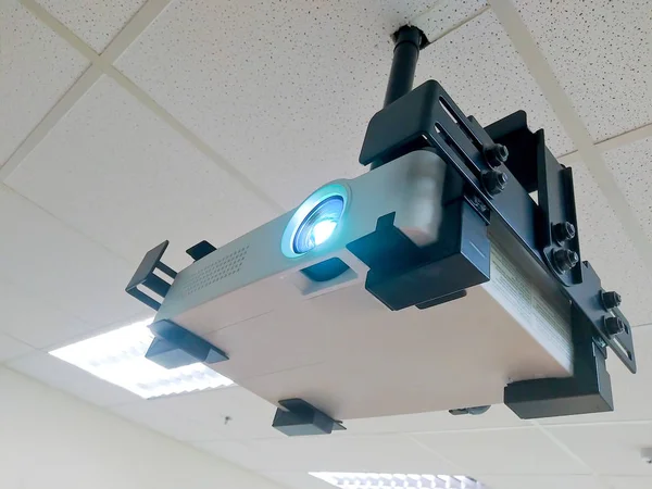 Digital projector working on ceiling room — Stock Photo, Image