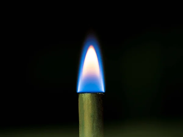 Close up shot on flame, hot spot details of fire on black — Stock Photo, Image