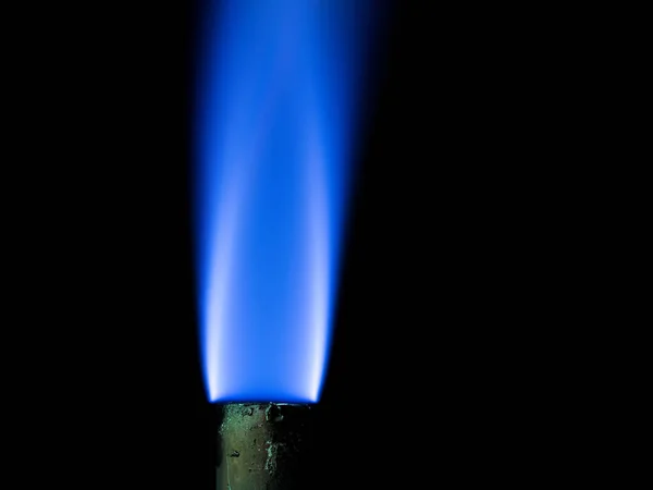 Close up shot on flame, hot spot details of fire on black — Stock Photo, Image