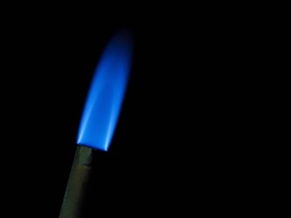 Close up shot on flame, hot spot details of fire on black — Stock Photo, Image