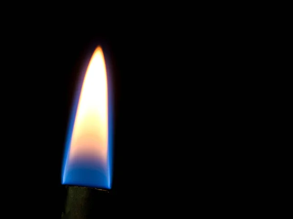 Close up shot on flame, hot spot details of fire on black — Stock Photo, Image