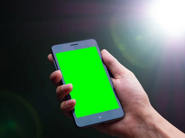 smart phone on Lens flare of strong light source in the dark, abstract background