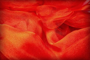 Dalgalı maddeden yapılmış güzel soyut kırmızı arka plan. Dekoratif kırmızı arkaplan