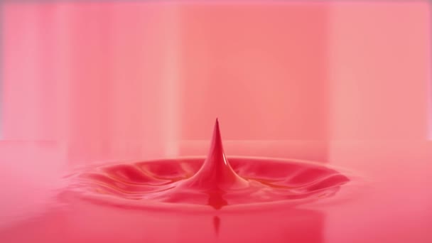 光のピンクの液体の中に落ちて小さなドロップのビュー — ストック動画