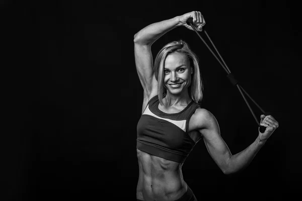 Beautiful fitness athlete on the black and white photo. — Stock Photo, Image