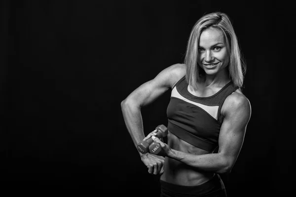 Beautiful fitness athlete on the black and white photo. — Stock Photo, Image