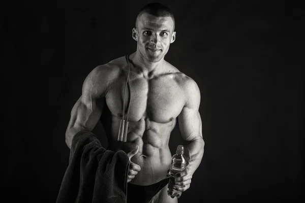 Embossed bodybuilder on a black background — Stock Photo, Image