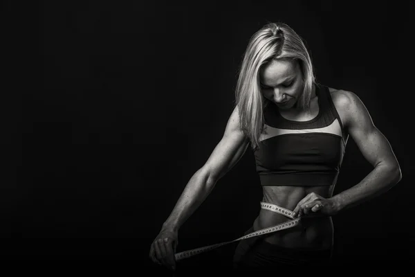 Sexy fitness woman on the black and white photo. — Stock Photo, Image