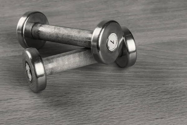 Dumbbells on the table — Stock Photo, Image