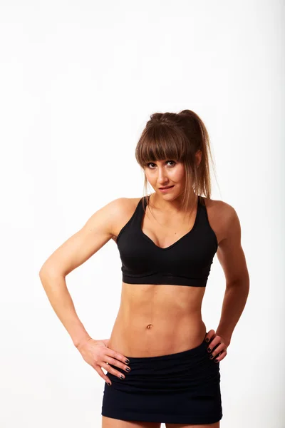 Chica de fitness posando en negro — Foto de Stock