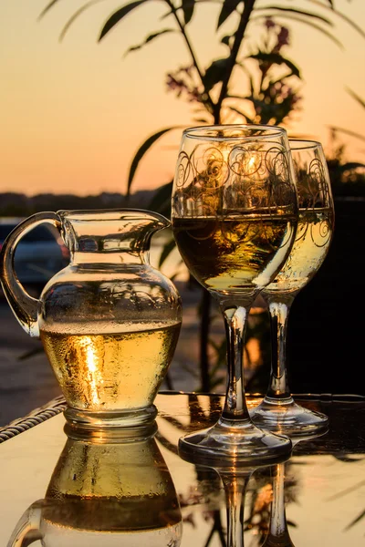 Glasses of wine on sunset