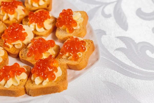 Canapes with salmon caviar Stock Image