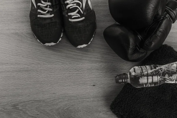 Fitness equipment on a table on a black and white photo. — Stock Photo, Image