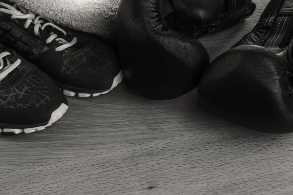 Fitness equipment on a table on a black and white photo. — Stock Photo, Image