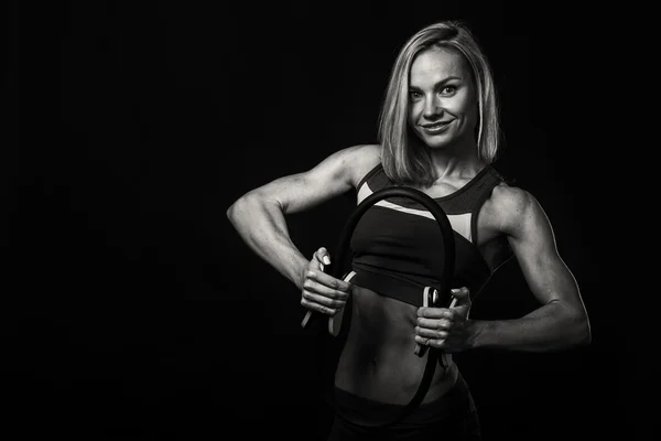 Sports girl on a dark background. — Stock Photo, Image