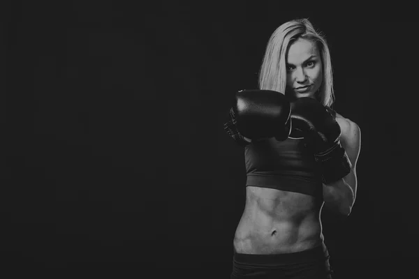 Fitness woman on a dark background. — Stock Photo, Image