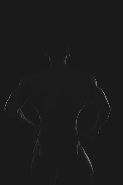 Silhouette of a strong man — Stock Photo, Image