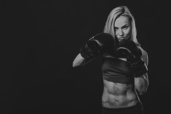 Fitness woman on a dark background. — Stock Photo, Image