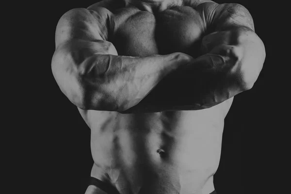 Bodybuilder on a black background — Stock Photo, Image