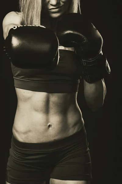 Sexy fitness woman on a black background — Stock Photo, Image