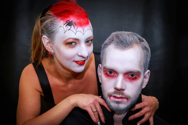 vampire couple on a black background