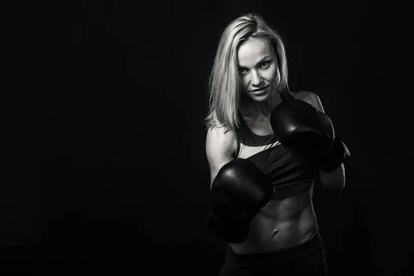 Athletic girl on a black background — Stock Photo, Image