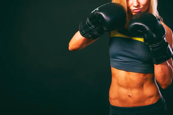 Athletic girl on a black background — Stock Photo, Image