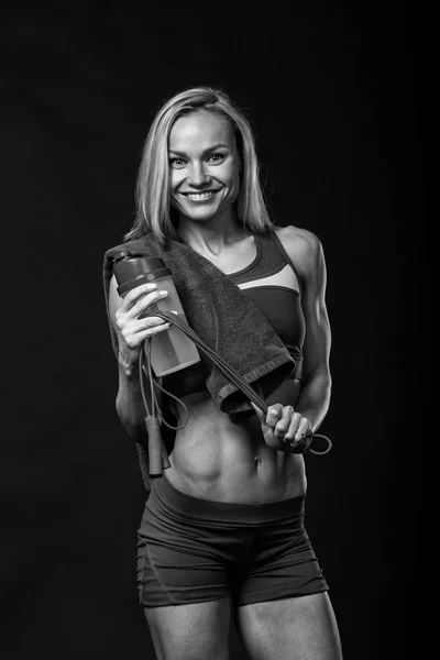 Female fitness on a black background — Stock Photo, Image