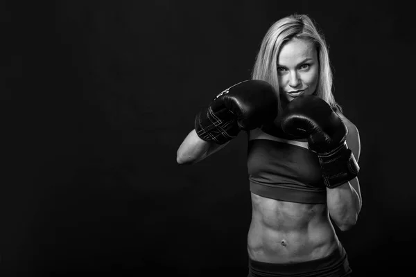 Female fitness on a black background — Stock Photo, Image