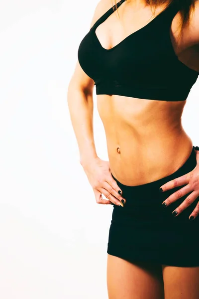 Kvinnliga fitness koncept på ljus bakgrund. — Stockfoto