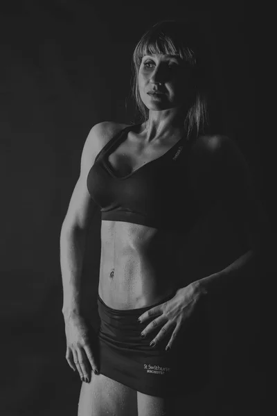 Female fitness on a black background — Stock Photo, Image