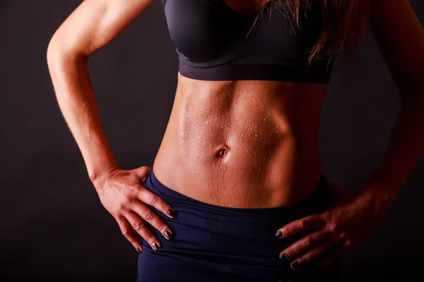 Figure fitness girl on a black background — Stock Photo, Image