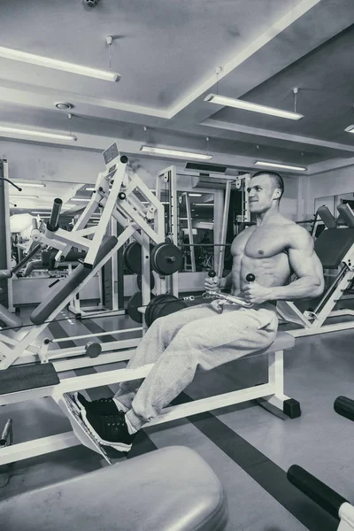 A man with a barbell exercise on biceps — Stock Photo, Image