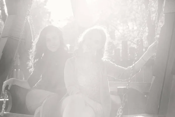 Girlfriends in autumn park — Stock Photo, Image