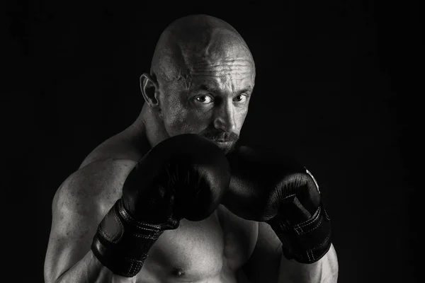 Big bodybuilder on a dark background — Stock Photo, Image