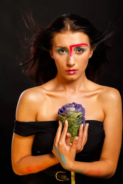 Fashion. Beautiful brunette posing on a dark background. — Stock Photo, Image