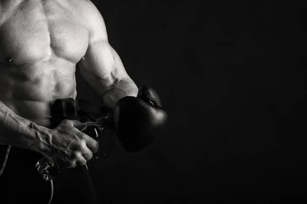 Big bodybuilder on a dark background — Stock Photo, Image