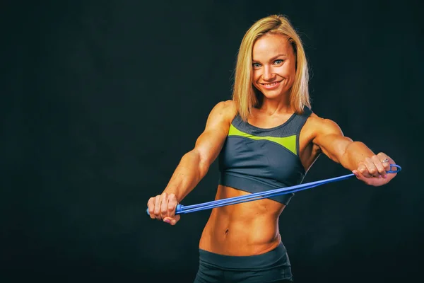 The body of a beautiful athletic girl on black — Stock Photo, Image