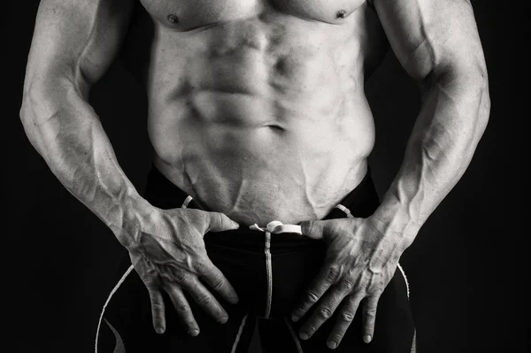 Muscular male body on a black and white photo. — Stock Photo, Image