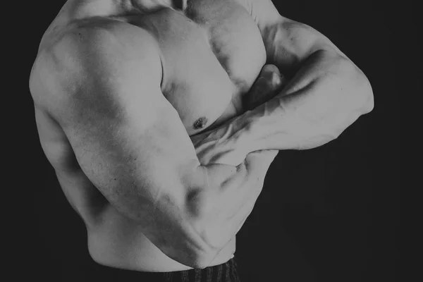 Muscular male body on a dark background. — Stock Photo, Image