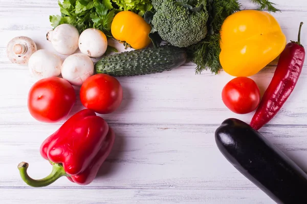 Vegetables on a black wooden background