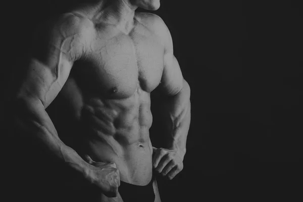 Bakgrunden på bodybuilding och manliga kroppen — Stockfoto
