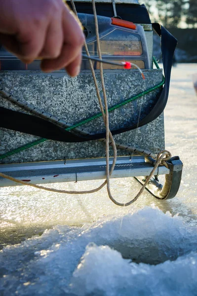 Winter fishing. Ice fishing. Fisherman on ice fishing from the w — Stock Photo, Image